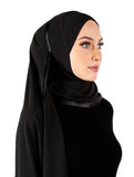 black kuwaiti hijab on model wrapped once and pinned on the side